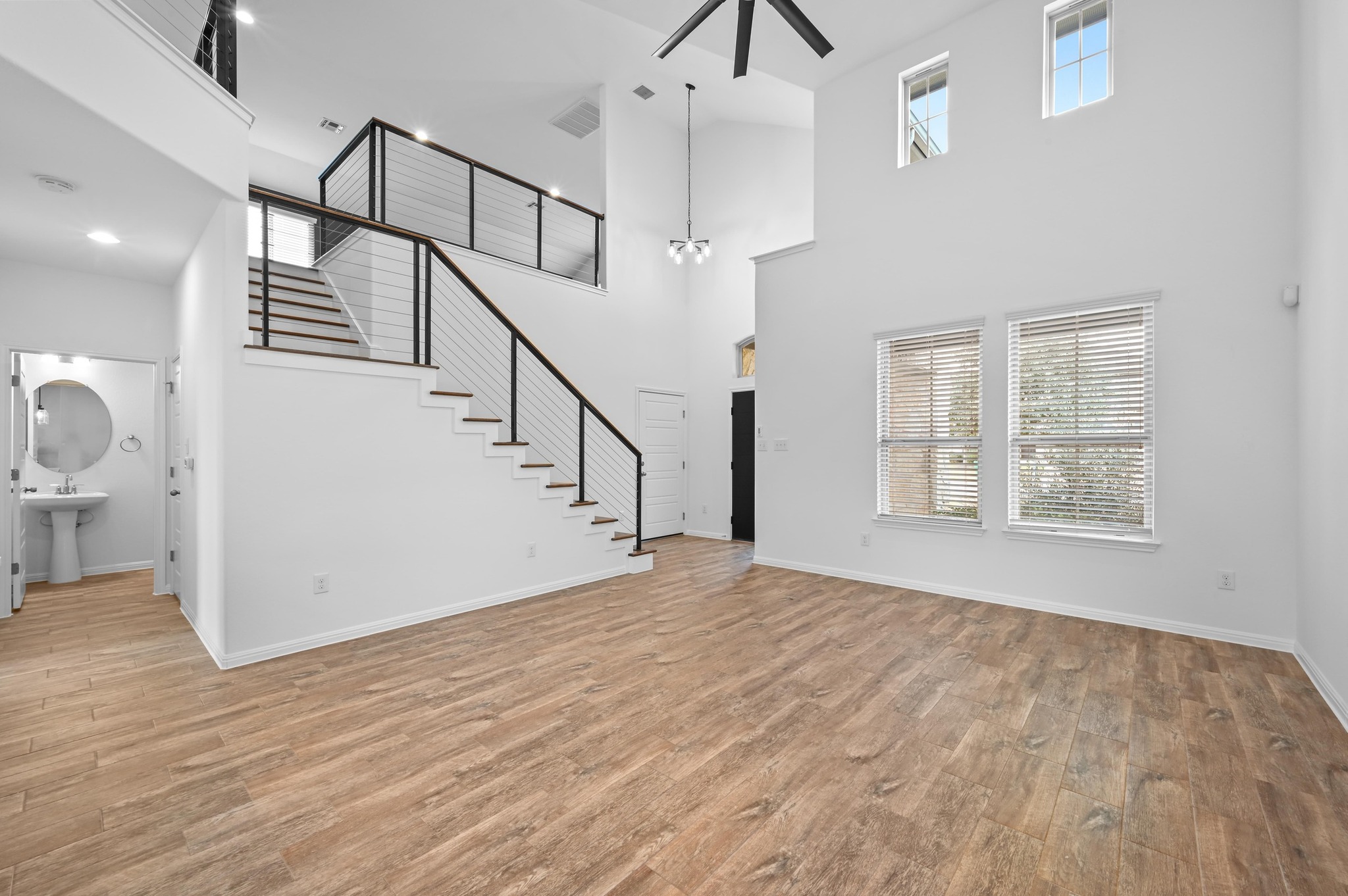 13221 Mariscan Street Manchaca, TX 78652 - Photo 9 of 36 a view of empty room with wooden floor and fan