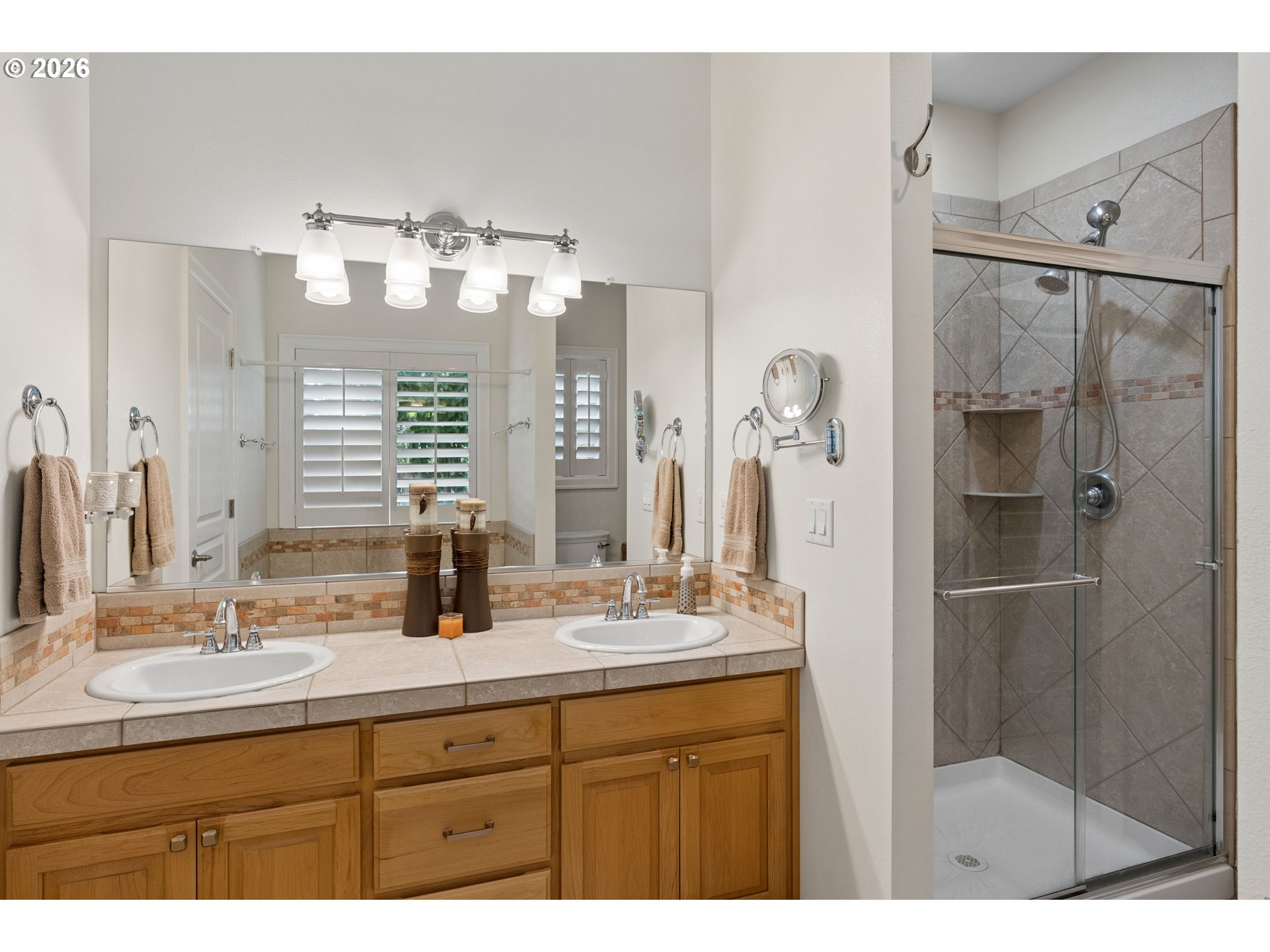 945 Northwest Angel Heights Road Stevenson, WA 98648 - Photo 20 of 41 a bathroom with a double vanity sink mirror and shower
