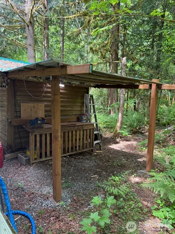 a view of a barn with a sink and a yard