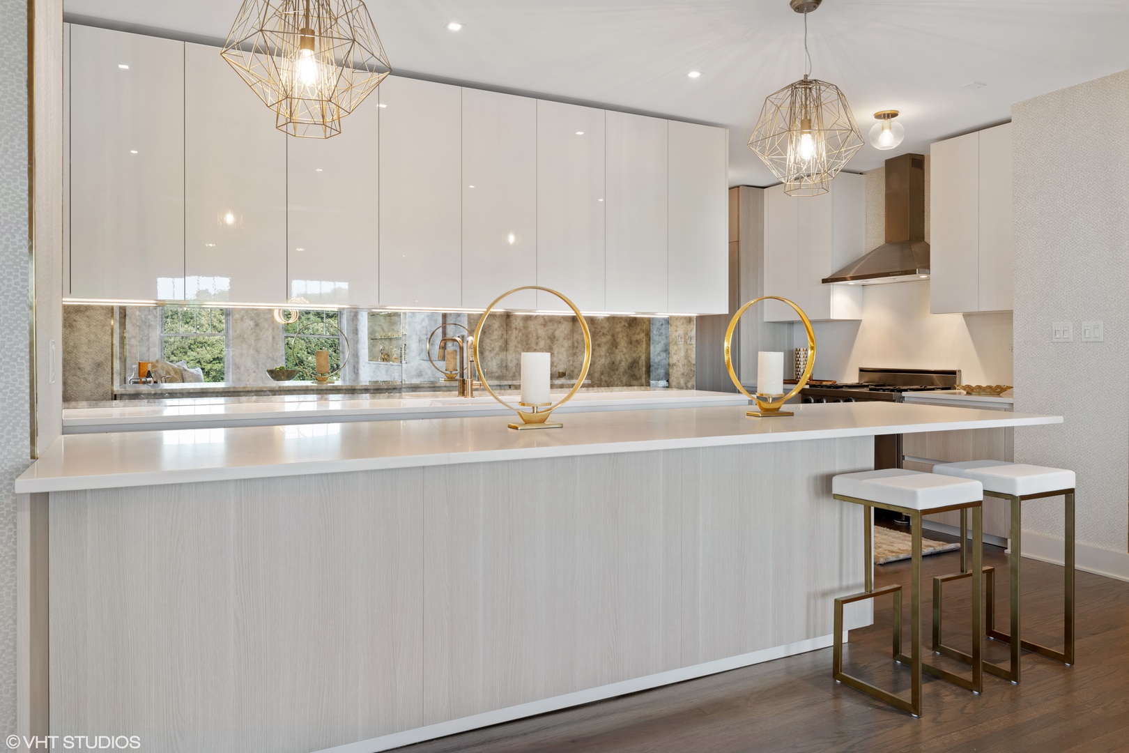 Undisclosed Address Chicago, IL 60657 - Photo 8 of 17 a kitchen with kitchen island stainless steel appliances a table and chairs in it