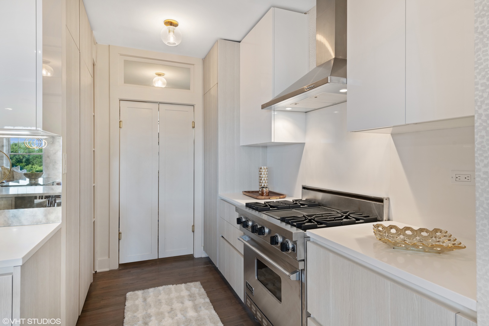 Undisclosed Address Chicago, IL 60657 - Photo 9 of 17 a kitchen that has a stove and a wooden floor