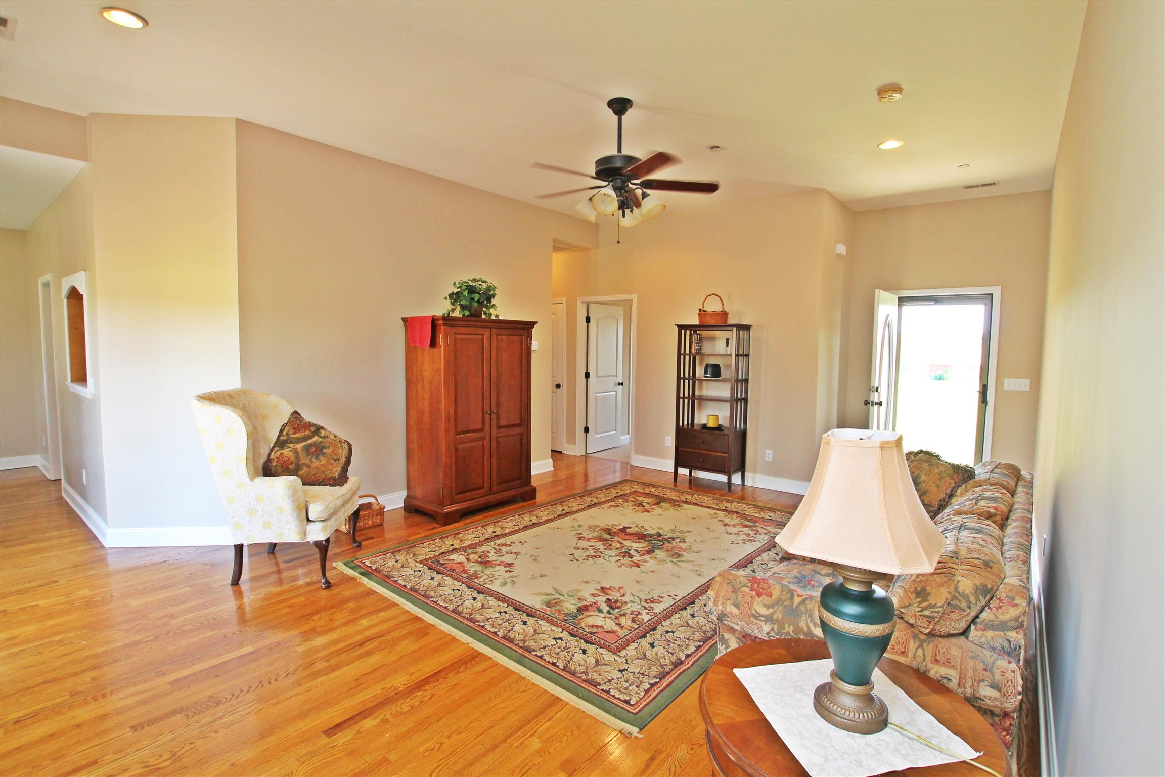 1012 Loganview Way Springfield, TN 37172 - Photo 2 of 30 a living room with table chairs and wooden floor
