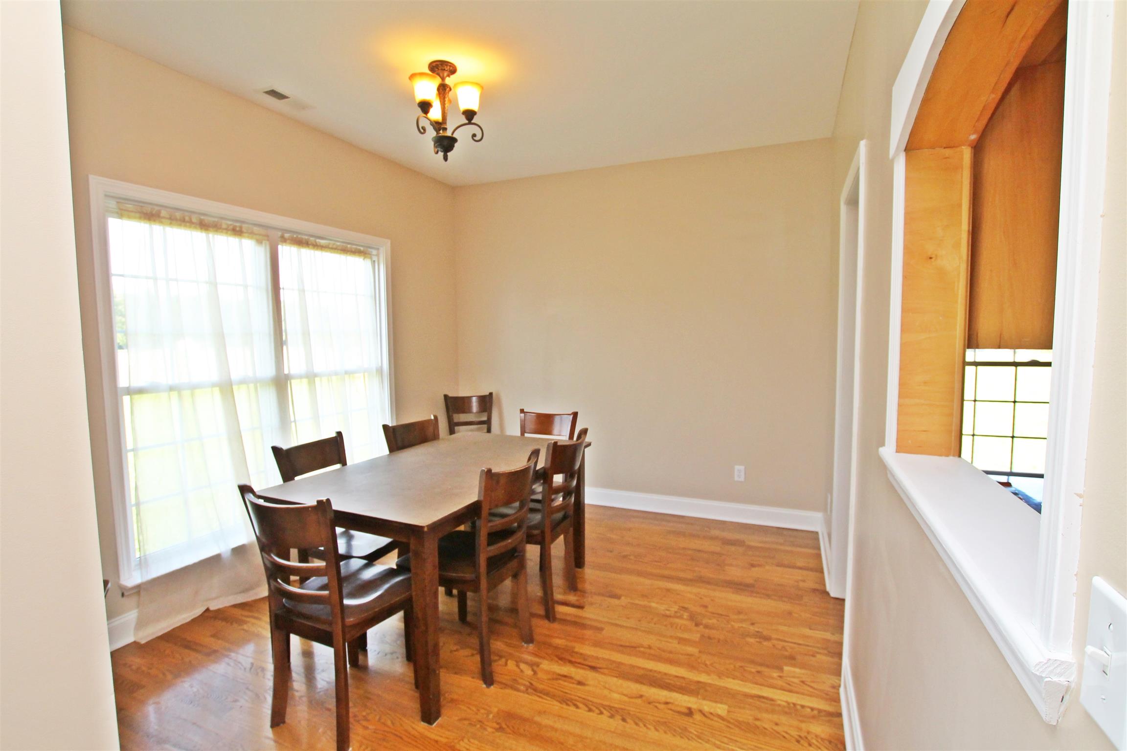 1012 Loganview Way Springfield, TN 37172 - Photo 11 of 30 a view of a dining room with furniture and a window