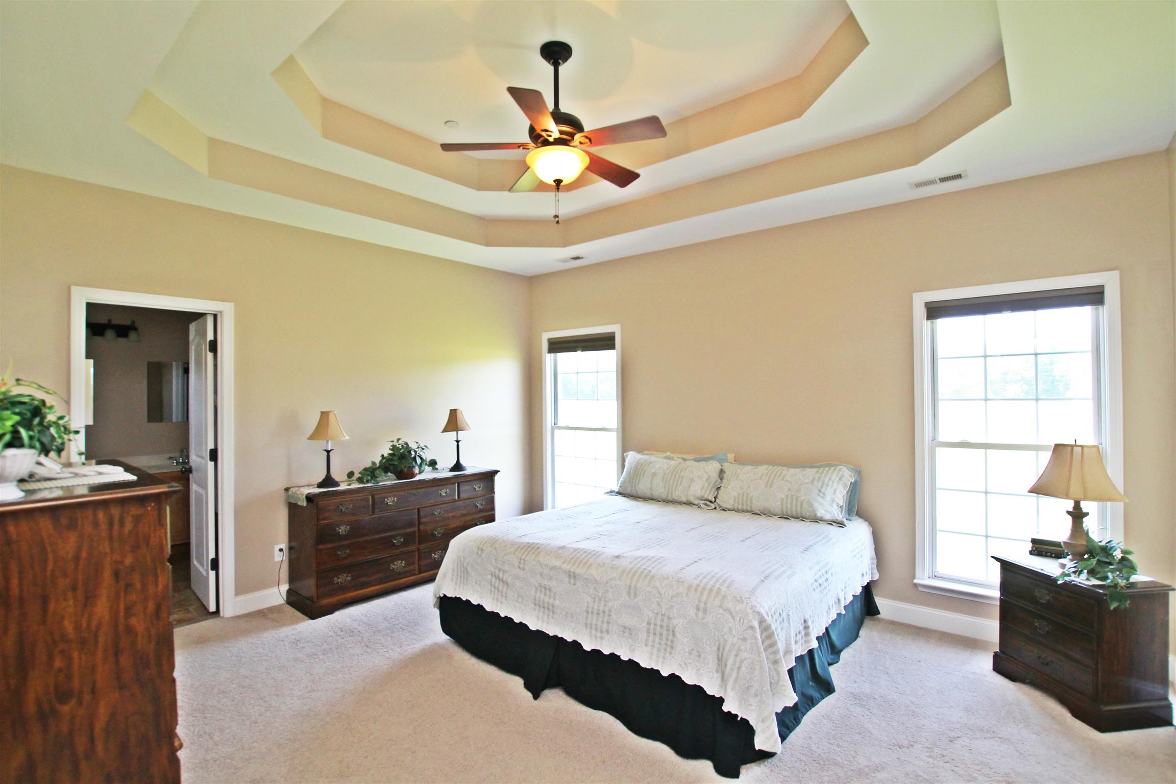 1012 Loganview Way Springfield, TN 37172 - Photo 13 of 30 a bedroom with a bed and a chandelier