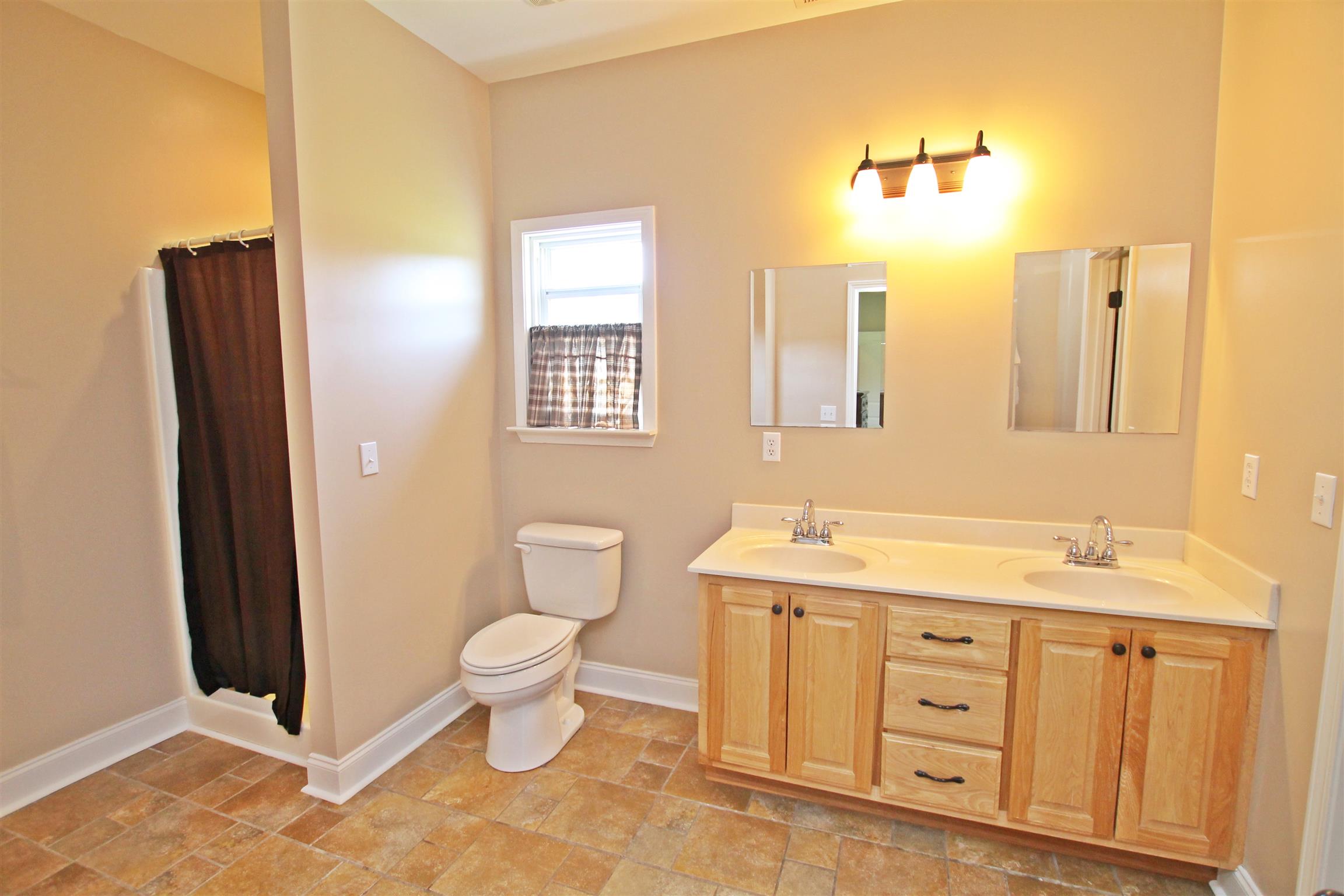 1012 Loganview Way Springfield, TN 37172 - Photo 16 of 30 a bathroom with a toilet sink and mirror