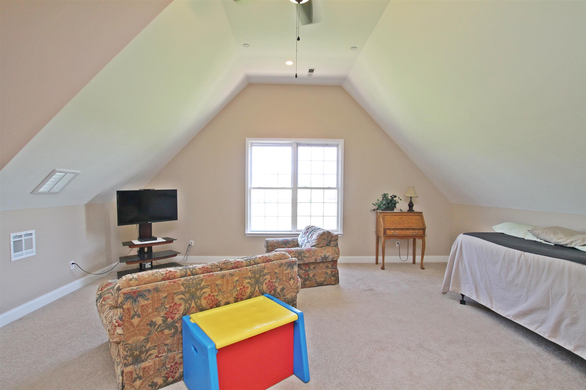 1012 Loganview Way Springfield, TN 37172 - Photo 24 of 30 a living room with furniture and a flat screen tv