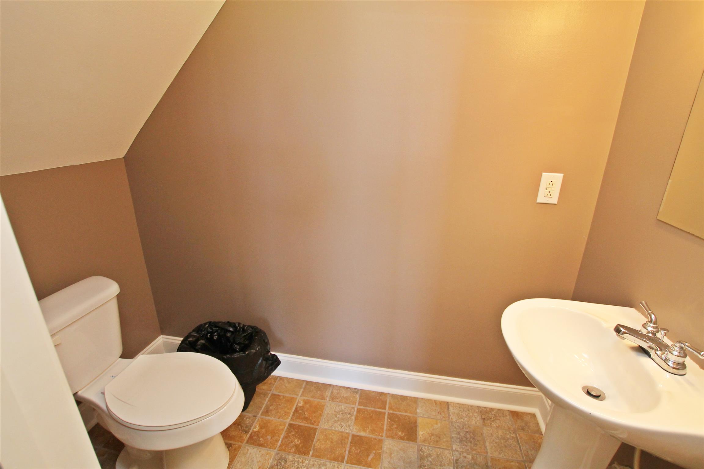 1012 Loganview Way Springfield, TN 37172 - Photo 25 of 30 a bathroom with a toilet and a sink