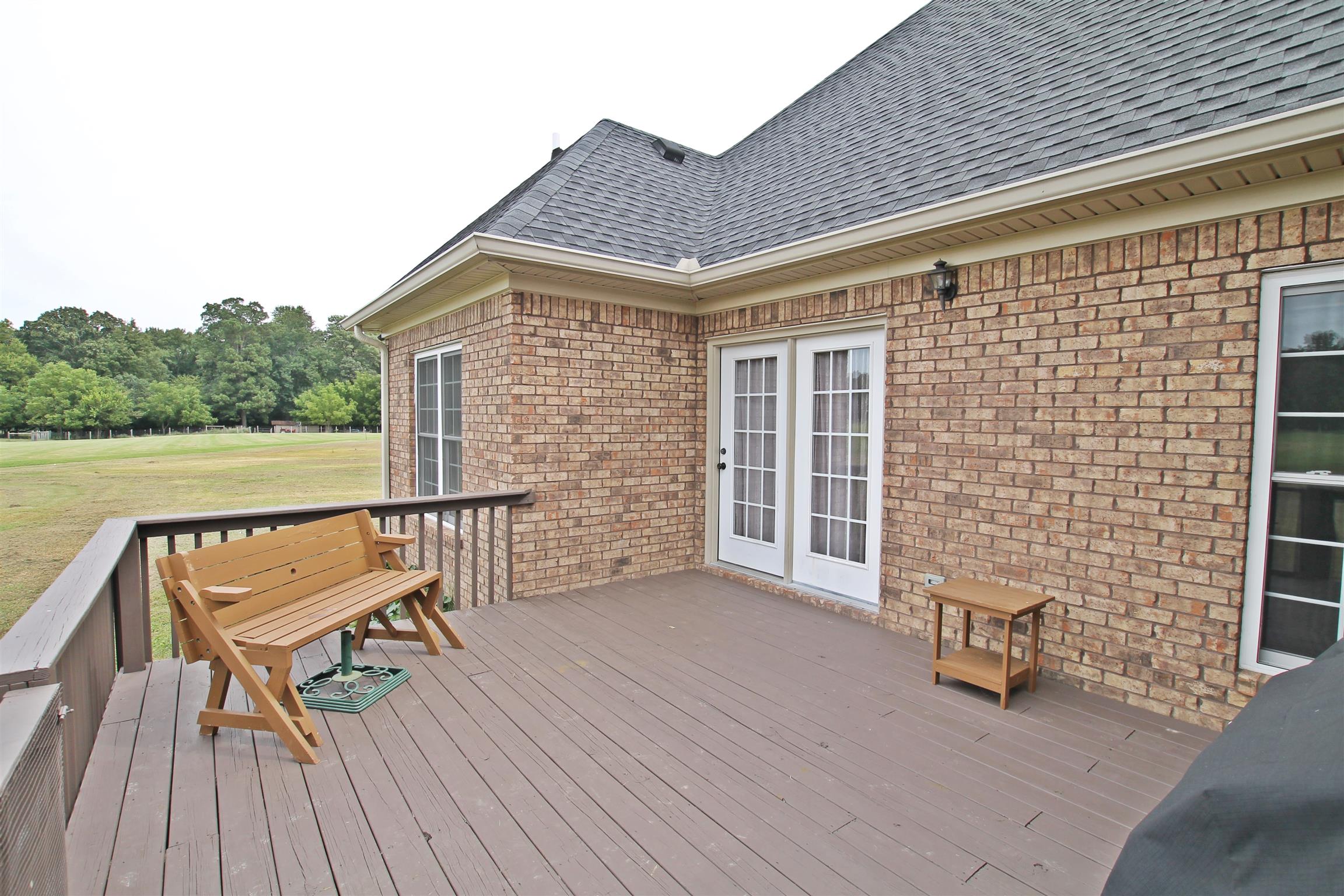 1012 Loganview Way Springfield, TN 37172 - Photo 26 of 30 a view of a roof deck with chair and wooden floor