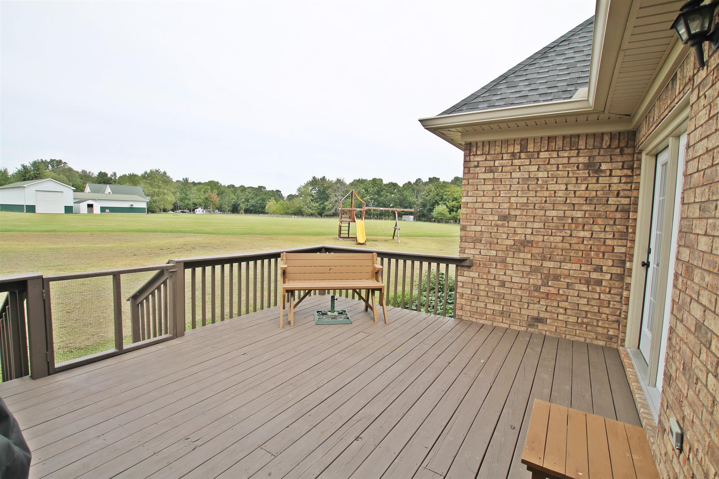 1012 Loganview Way Springfield, TN 37172 - Photo 27 of 30 a view of a deck with wooden floor and fence next to a yard