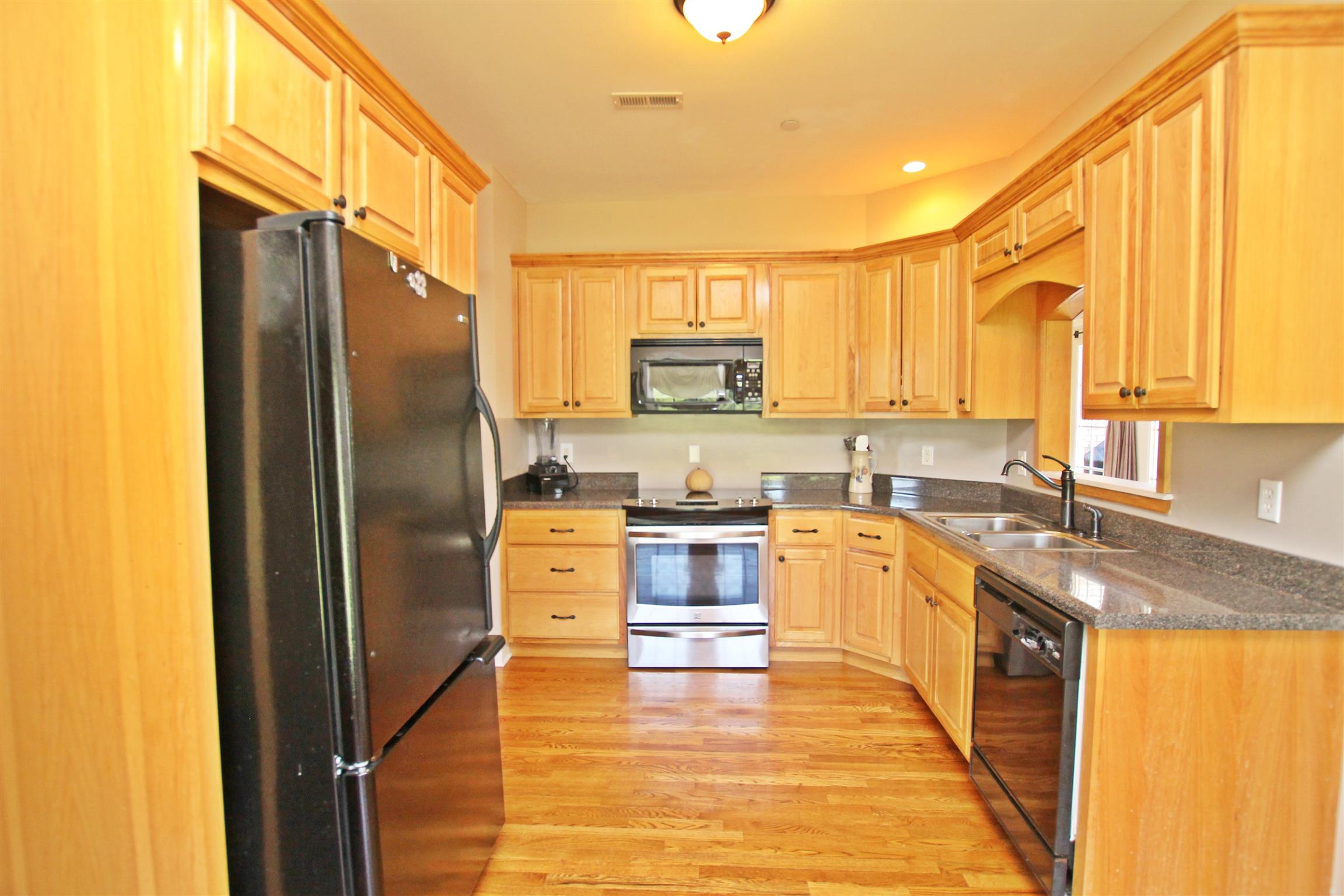 1012 Loganview Way Springfield, TN 37172 - Photo 6 of 30 a large kitchen with stainless steel appliances granite countertop a refrigerator a stove and a sink