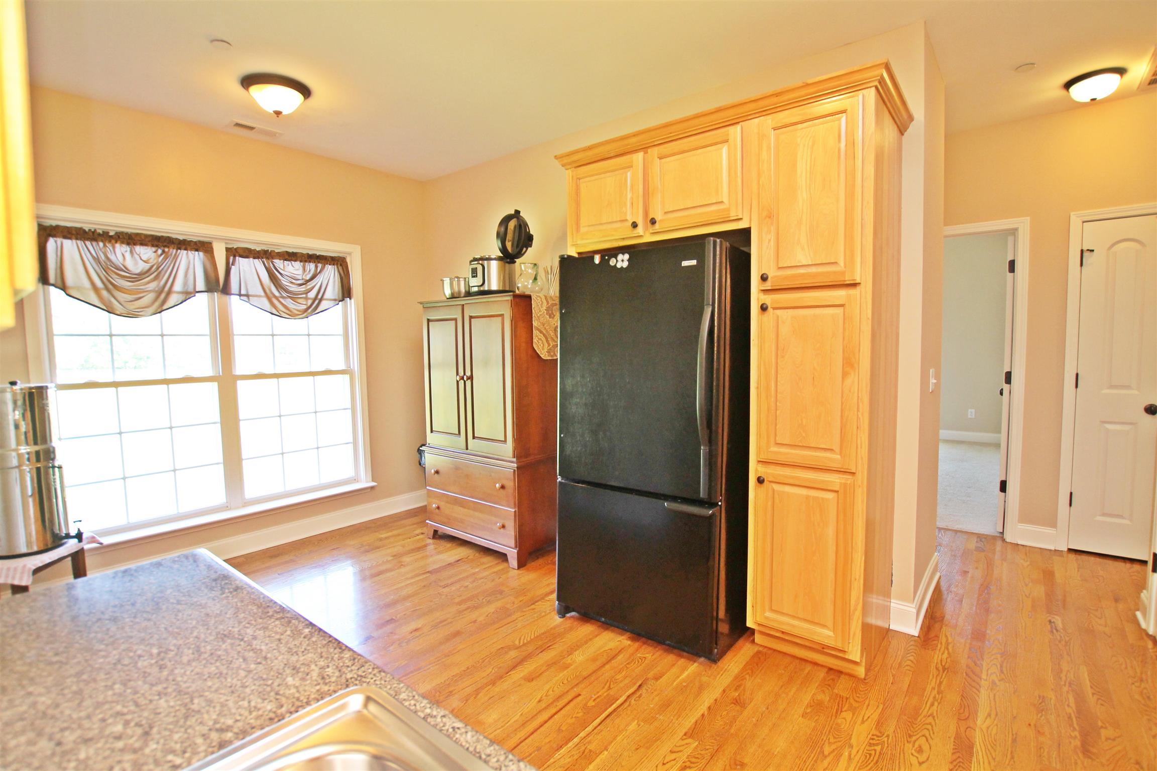 1012 Loganview Way Springfield, TN 37172 - Photo 10 of 30 a kitchen with stainless steel appliances granite countertop a refrigerator and a stove top oven