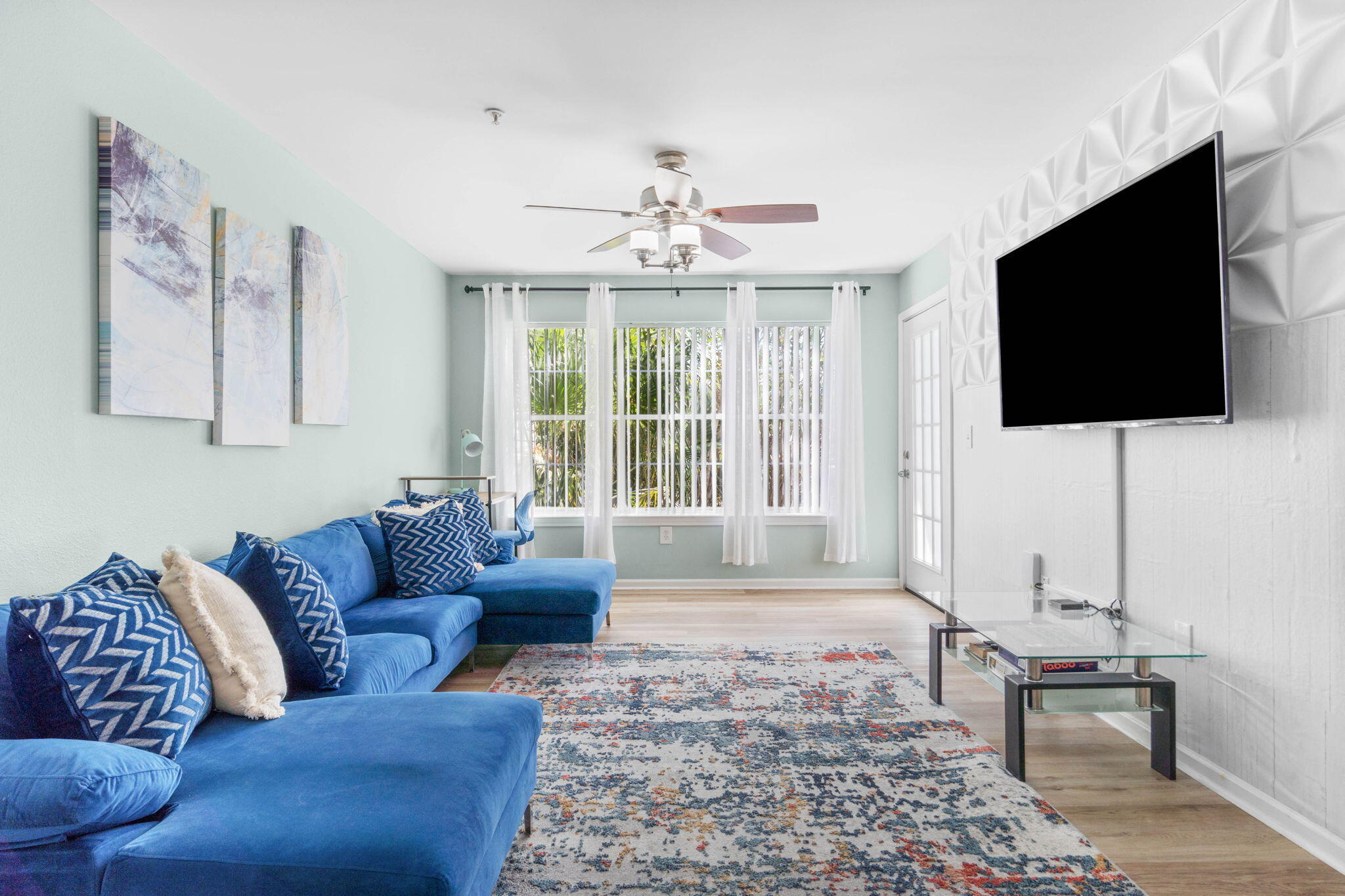 4075 Dancing Cloud Court, Unit 200 Destin, FL 32541 - Photo 5 of 33 a living room with furniture and a flat screen tv