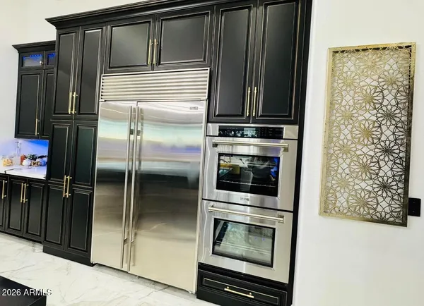 a room with pool table and windows