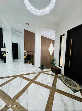a spacious bathroom with a granite countertop sink and a mirror