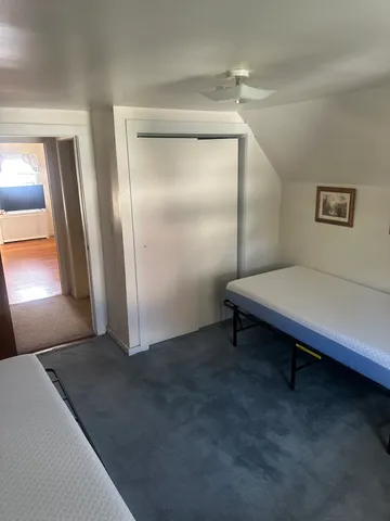 a view of a room with furniture and a window