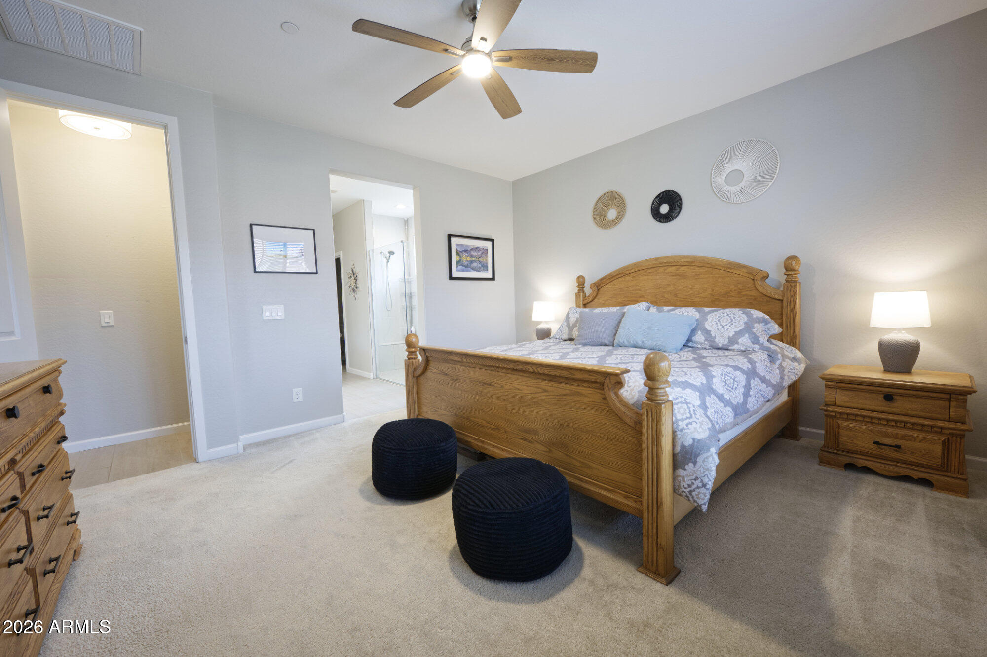 576 Whistle Stop Road Clarkdale, AZ 86324 - Photo 15 of 50 a bedroom with a bed and a chandelier