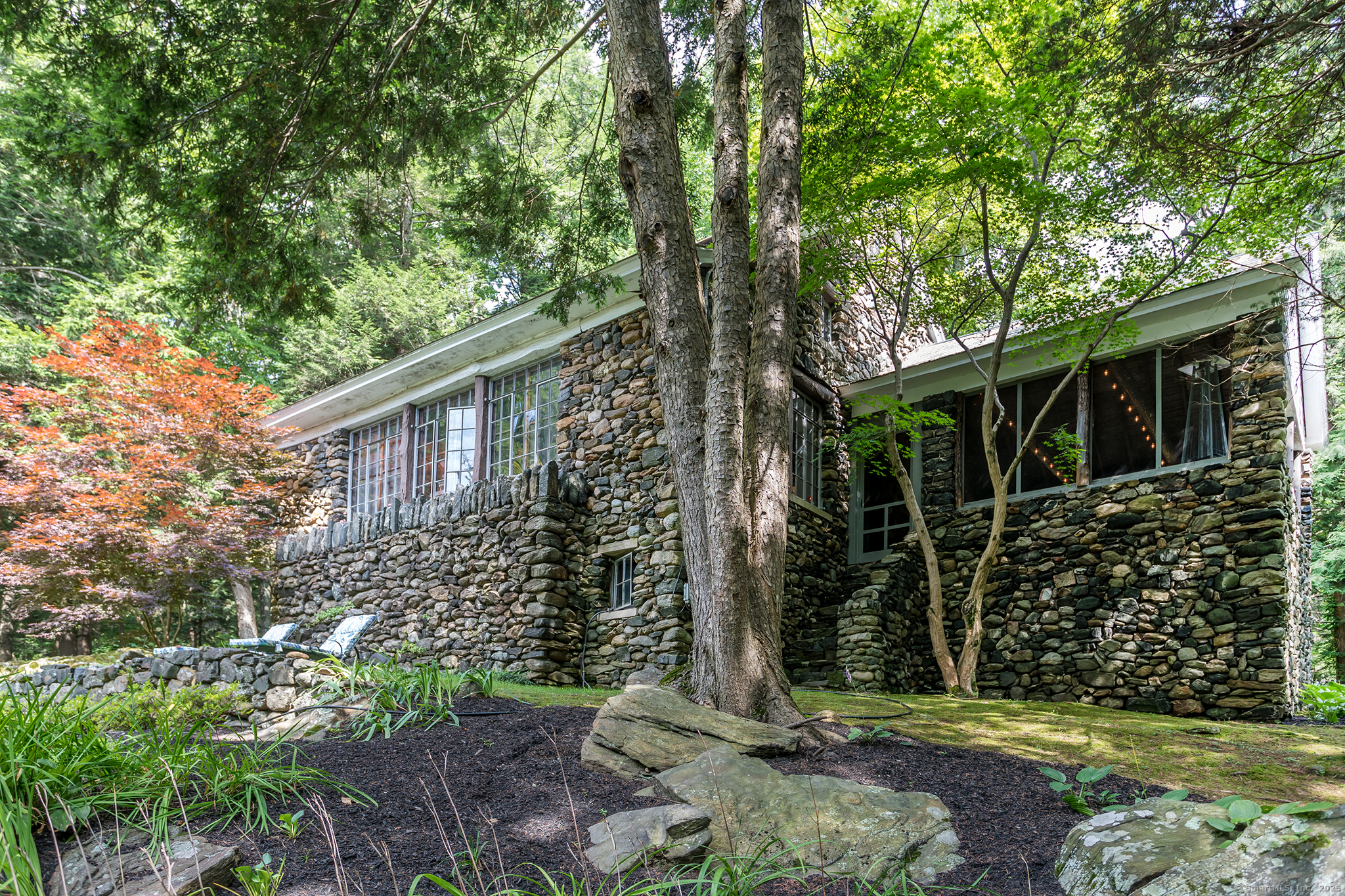60 Leach Hollow Road Sherman, CT 06784 - Photo 5 of 24 a view of a house with a tree in the yard
