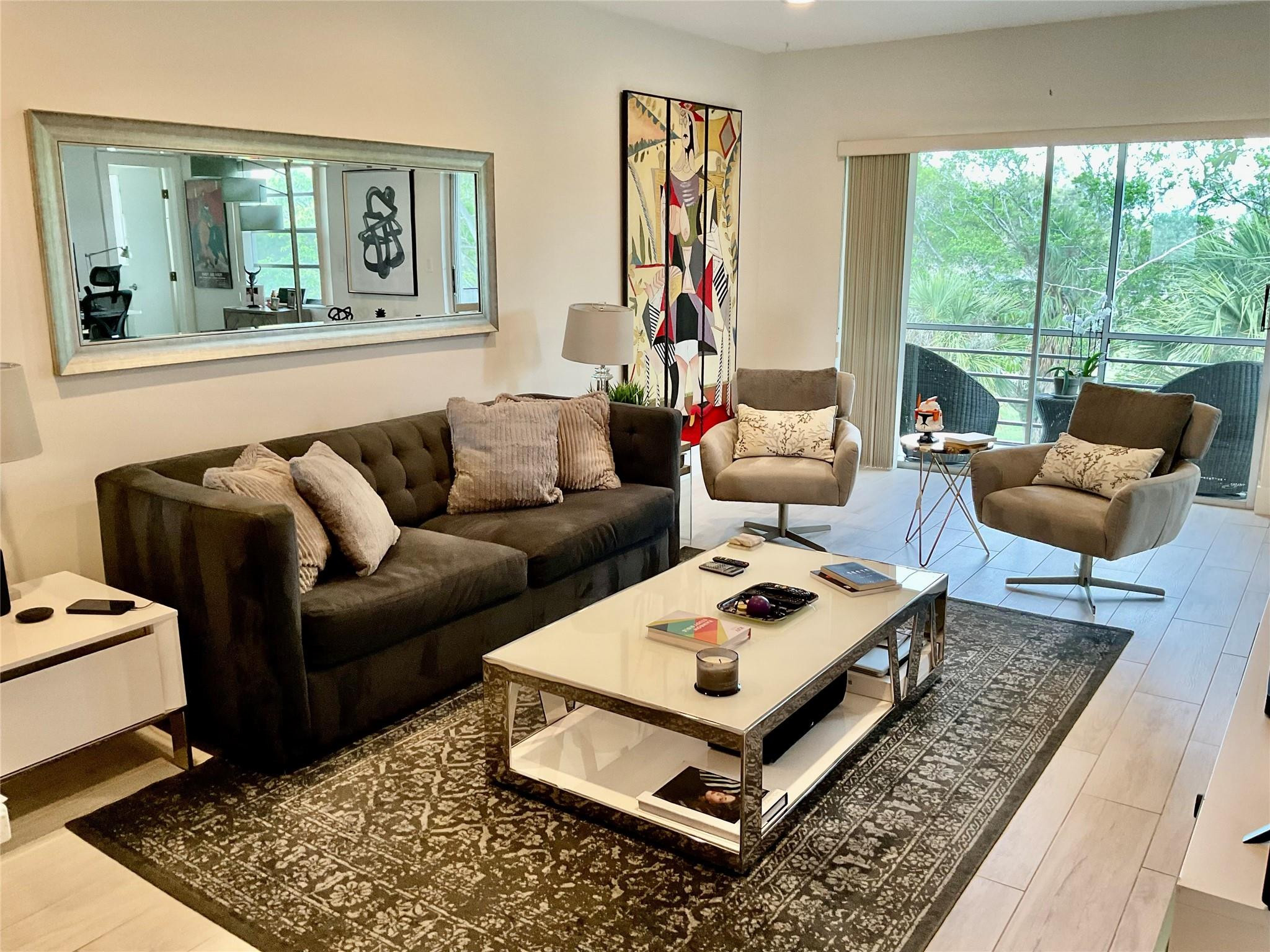 a living room with furniture and a rug