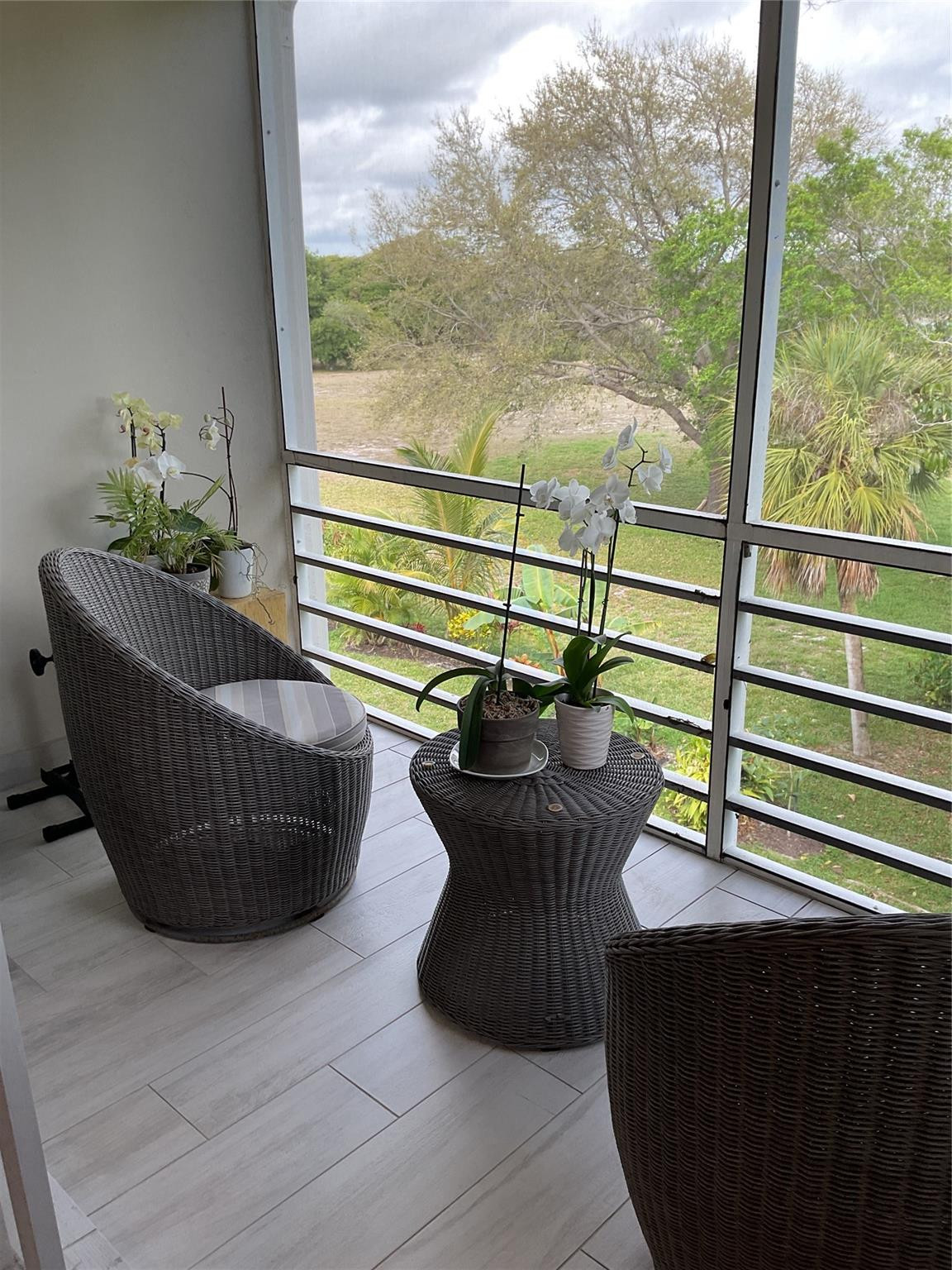 Undisclosed Address Boca Raton, FL 33487 - Photo 6 of 8 a view of a chair and table in the balcony