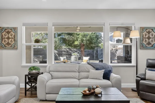 a view of a patio with table and chairs and potted plants