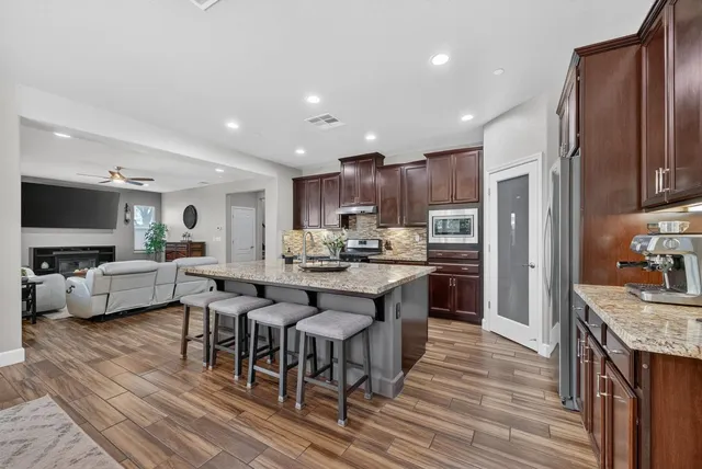 a kitchen with a table and chairs in it
