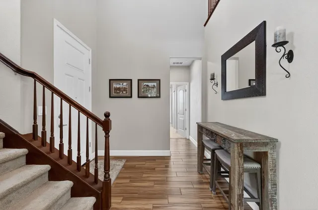 a bathroom with a sink a toilet a glass door and shower