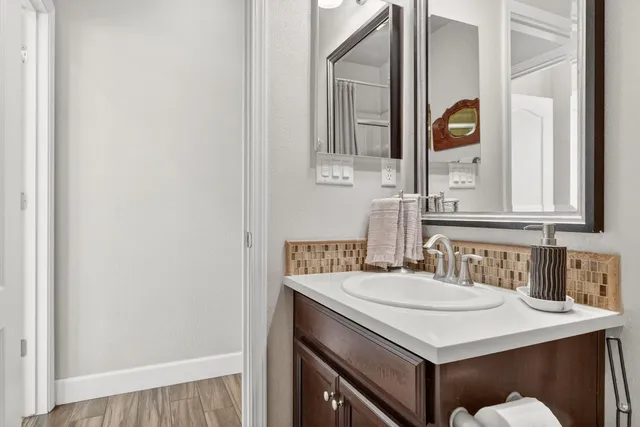 a bathroom with a sink and a mirror