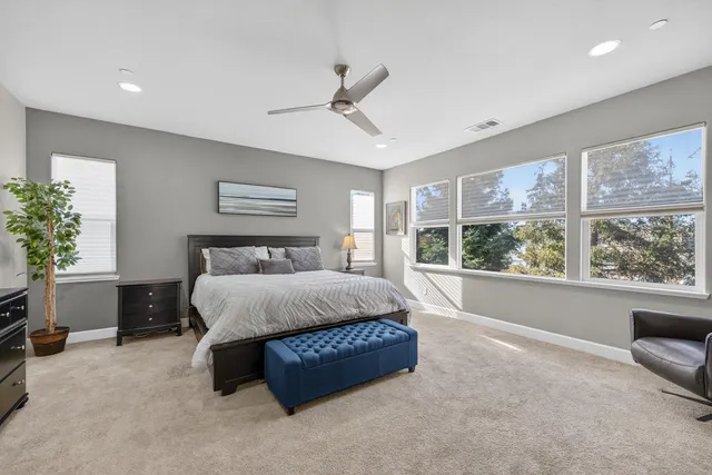 a bedroom with a bed and a tv