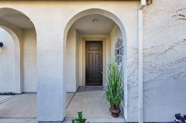 a view of a hallway with wooden floor and stairs