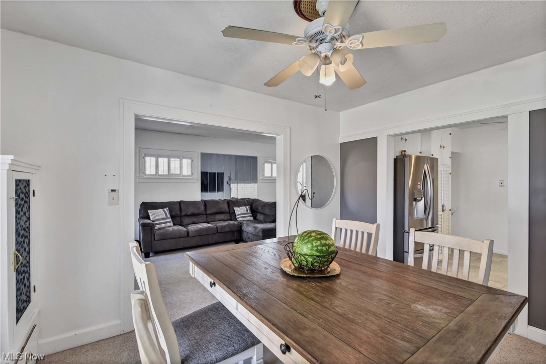 7705 Spring Garden Road Cleveland, OH 44129 - Photo 11 of 32 Carpeted dining room featuring ceiling fan