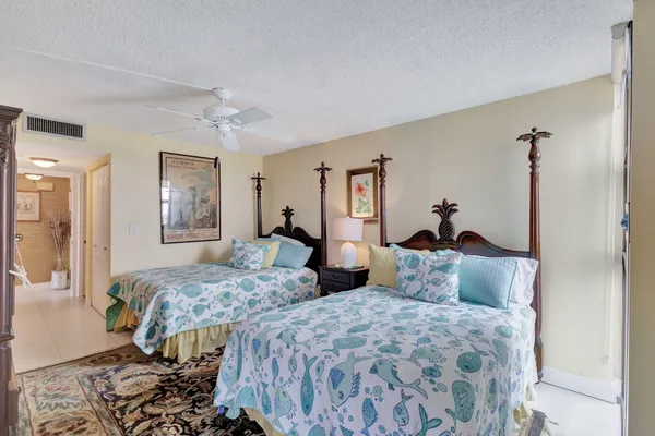 a view of a lake with houses in the back