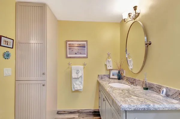 a kitchen with stainless steel appliances kitchen island granite countertop a table and chairs