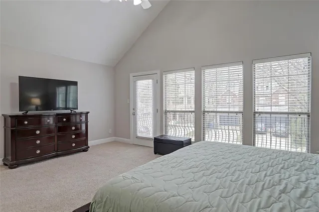 a bathroom with a granite countertop sink double vanity and mirror