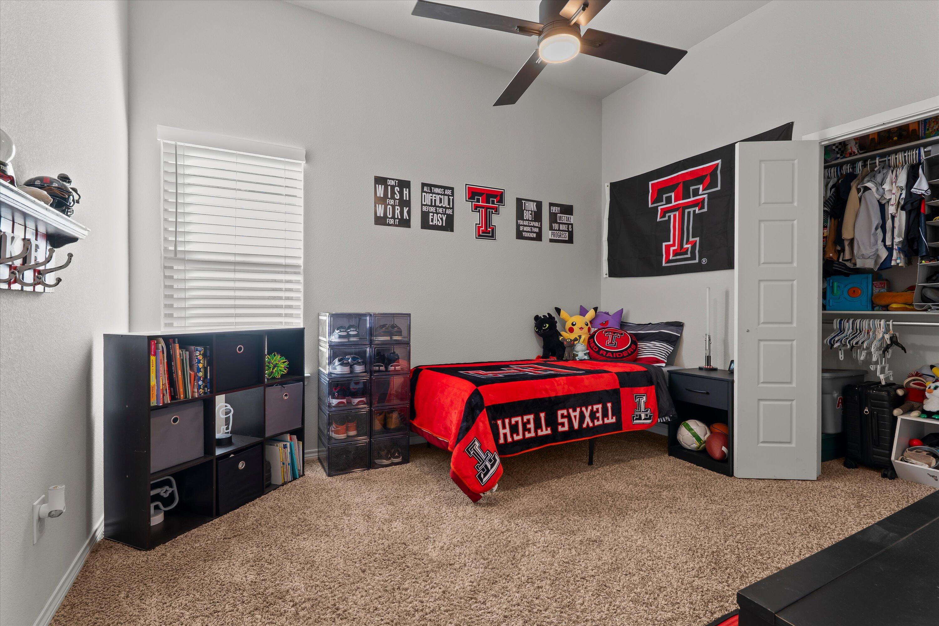 3438 125th Street Lubbock, TX 79423 - Photo 20 of 34 a bed room with a bed and a window