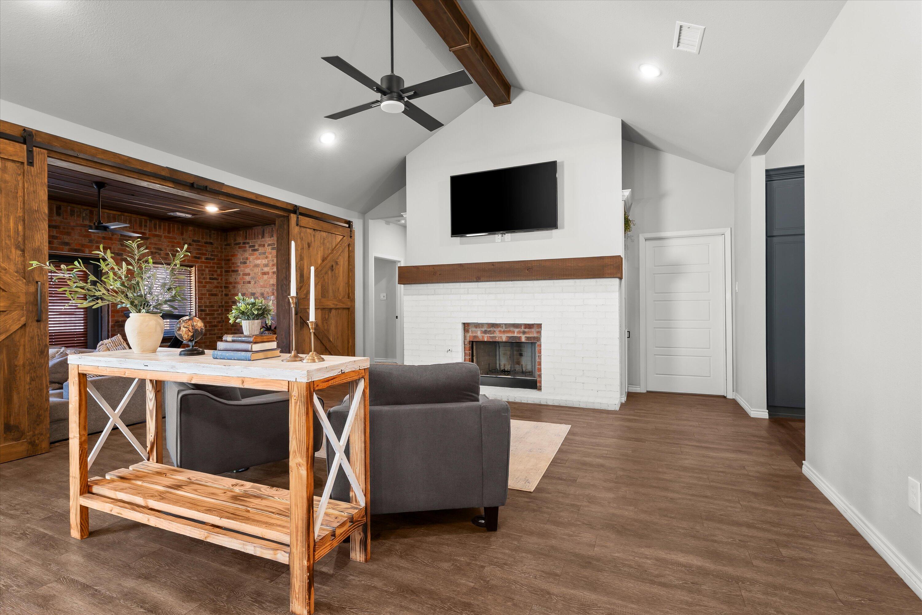 3438 125th Street Lubbock, TX 79423 - Photo 7 of 34 a view of living room with furniture and a fireplace