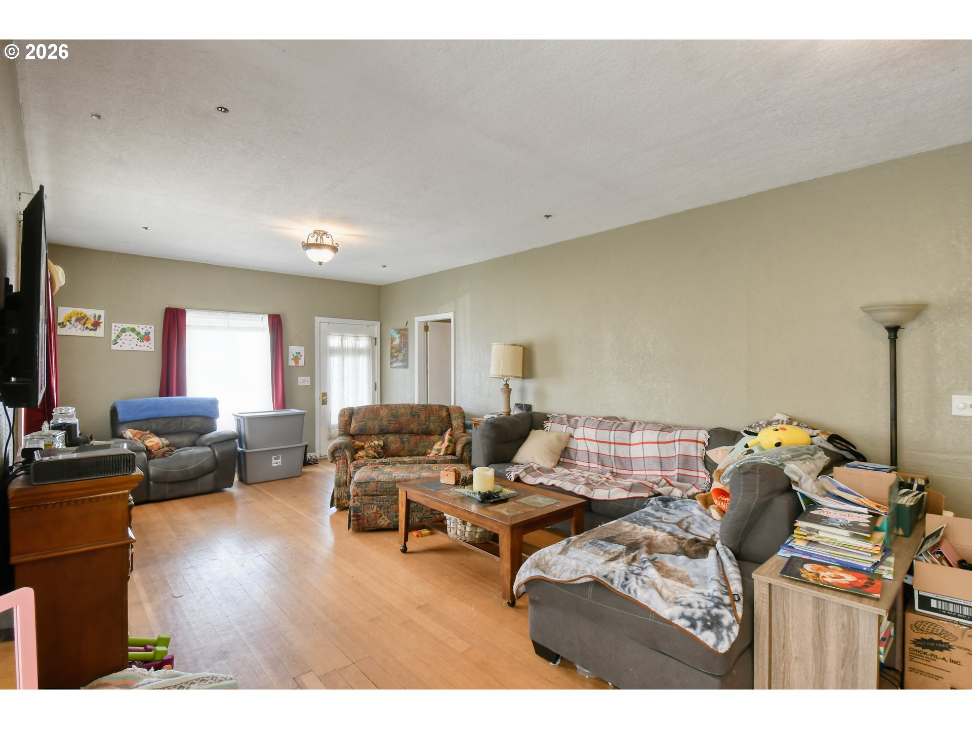 607 Southwest Court Avenue Pendleton, OR 97801 - Photo 9 of 48 a living room with furniture and a flat screen tv