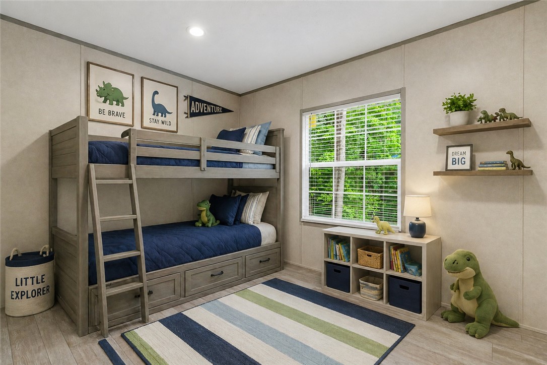 419 Austin Drive Anderson, SC 29624 - Photo 9 of 36 This cheerful bedroom features a bunk bed and a window with vibrant outdoor views.