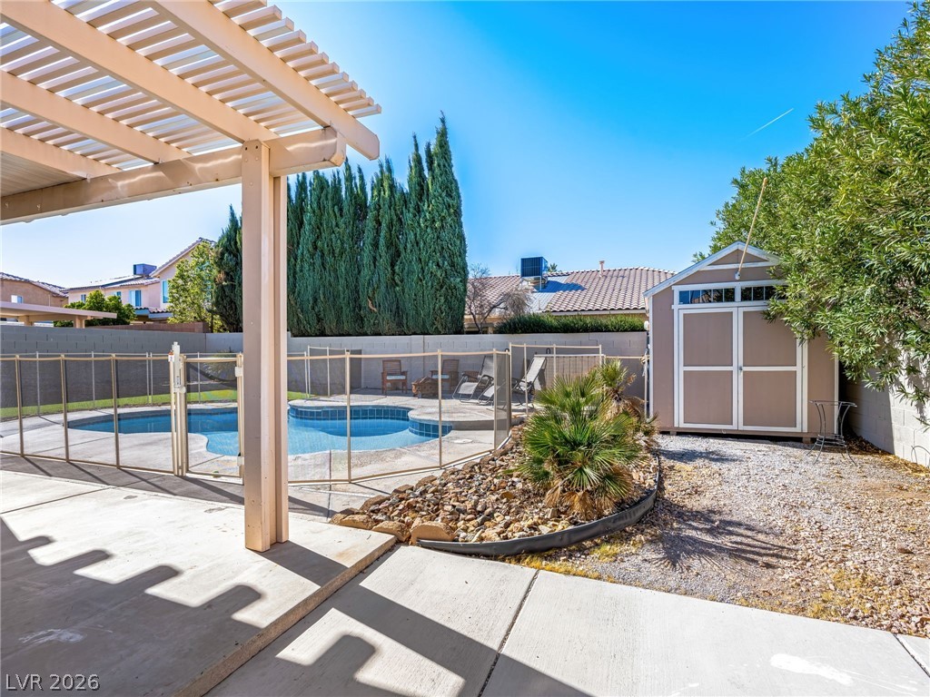 2199 Maple Shade Street Henderson, NV 89002 - Photo 41 of 75 Resurfaced pool with all-new fencing, surrounded by artificial turf for year-round greenery. Fenced backyard includes a shed, large covered patio for entertaining and shade, and RV parking with poured concrete and a large RV gate.