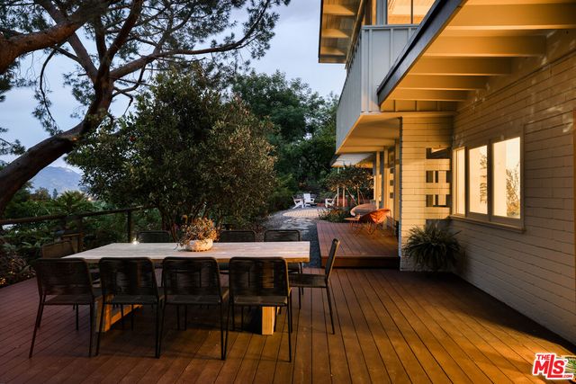 a patio with tables and chairs