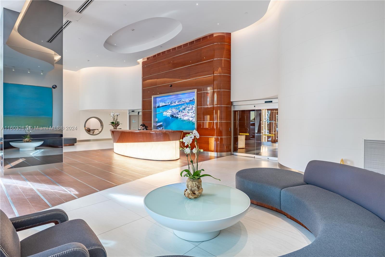 90 Alton Road, Unit 2806 Miami Beach, FL 33139 - Photo 20 of 36 a living room with furniture and a fireplace