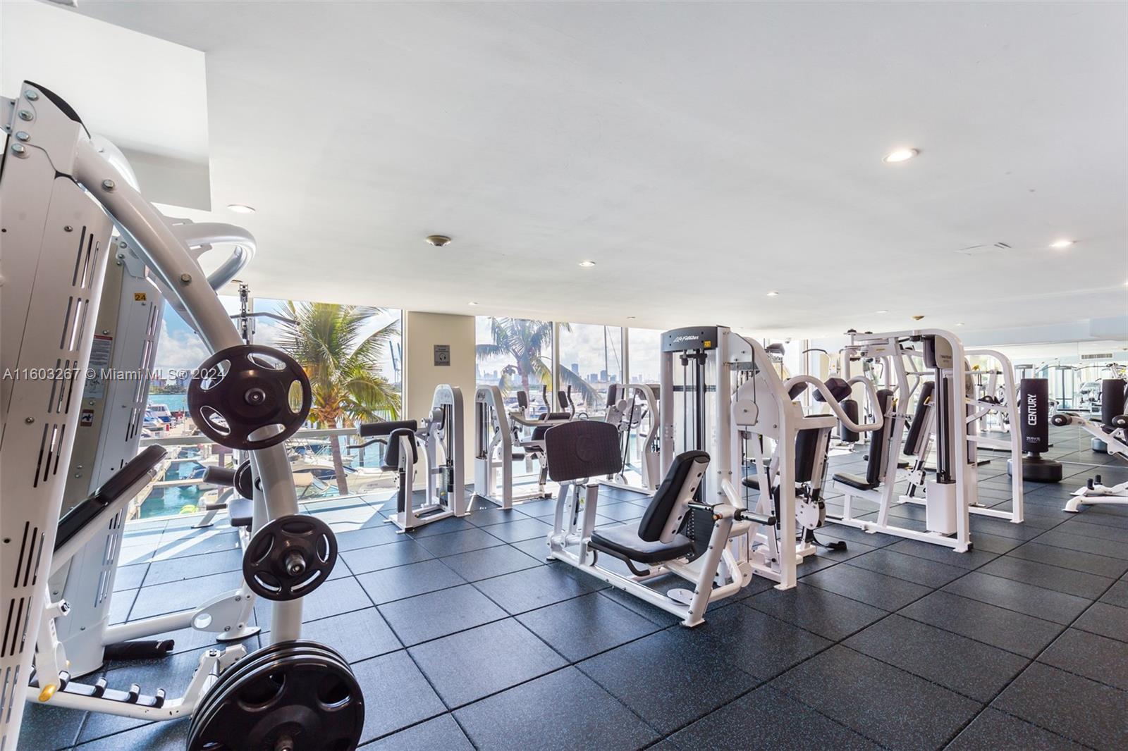 90 Alton Road, Unit 2806 Miami Beach, FL 33139 - Photo 29 of 36 a view of a room with gym equipment