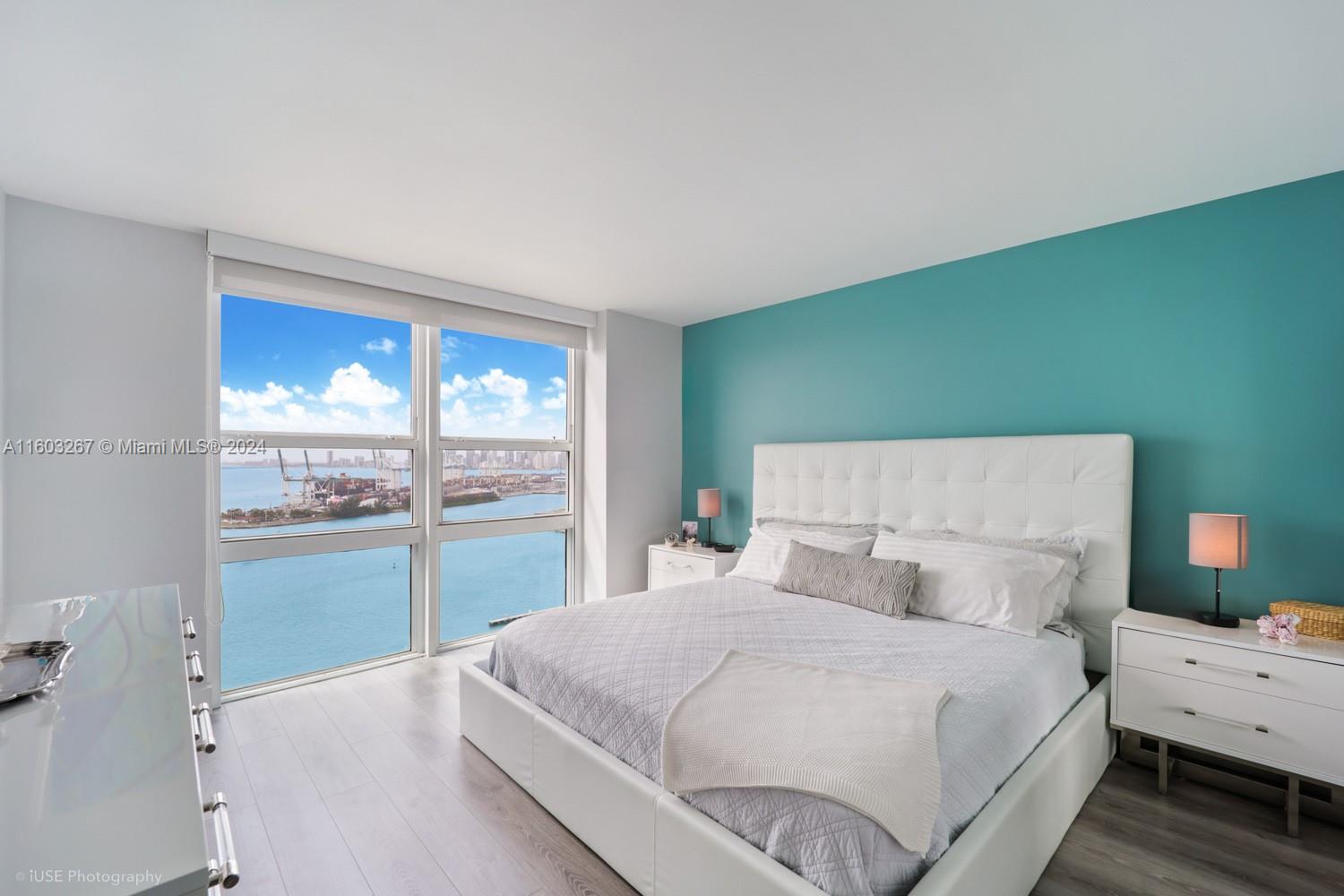 90 Alton Road, Unit 2806 Miami Beach, FL 33139 - Photo 5 of 36 a large white bed in a white room