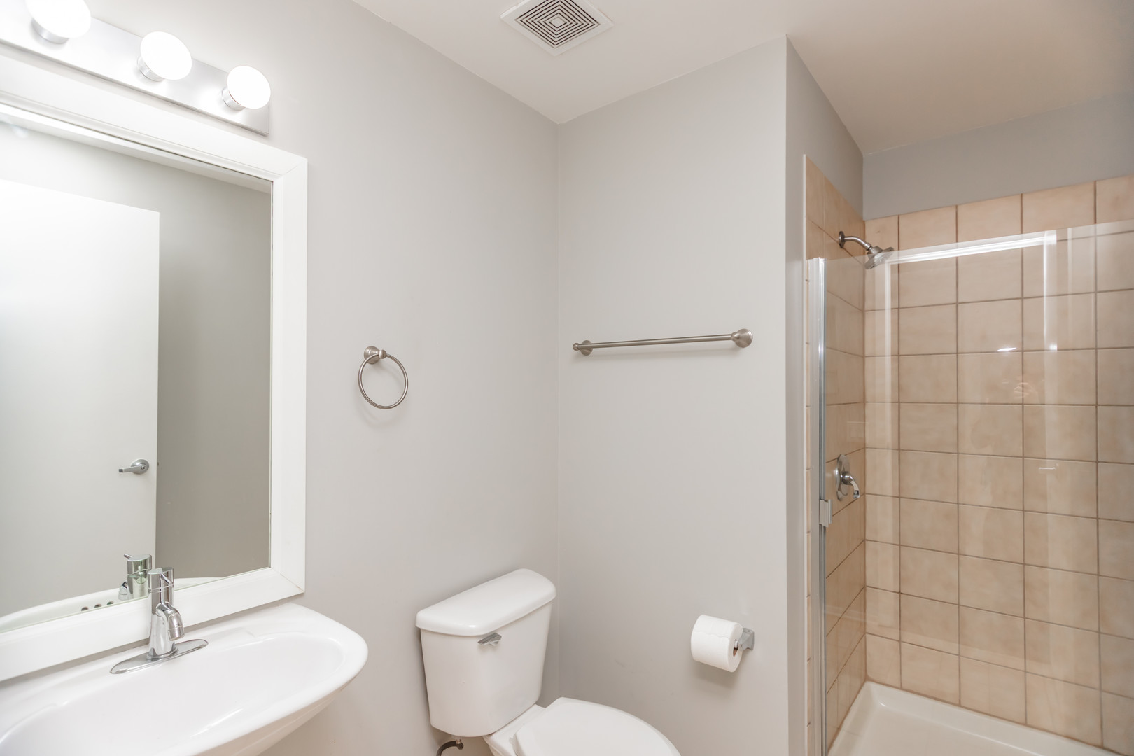 1530 South State Street, Unit 14O Chicago, IL 60605 - Photo 13 of 20 a bathroom with a sink a toilet and shower
