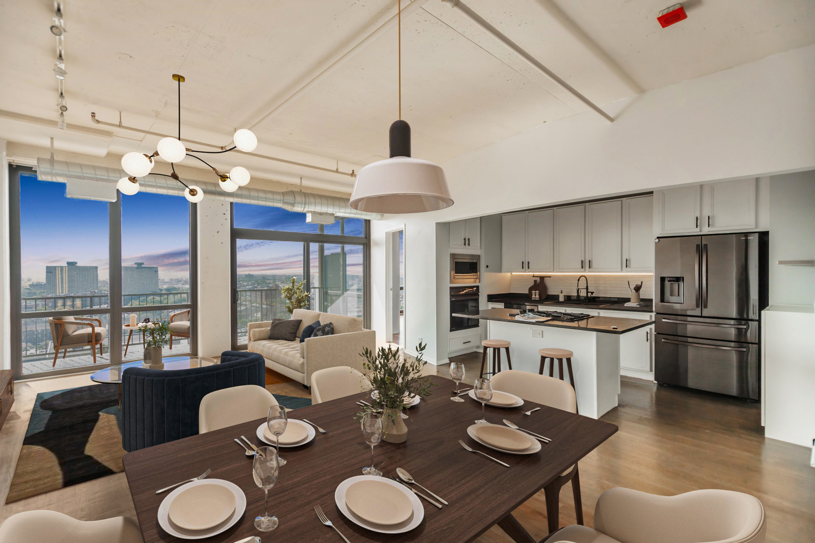1530 South State Street, Unit 14O Chicago, IL 60605 - Photo 2 of 20 a kitchen with stainless steel appliances granite countertop a stove a refrigerator a kitchen island a dining table and chairs with wooden floor