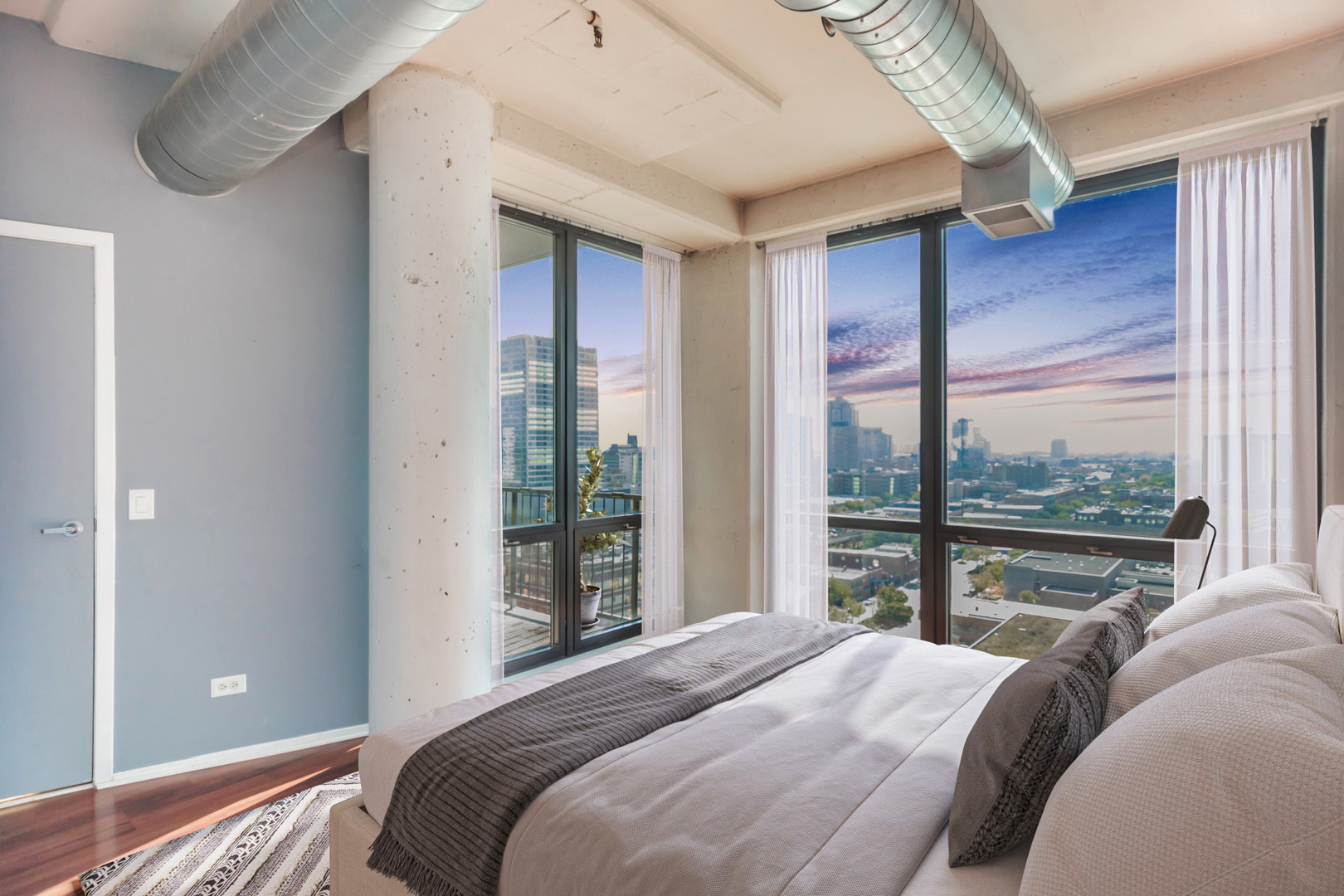 1530 South State Street, Unit 14O Chicago, IL 60605 - Photo 9 of 20 a bedroom with a bed and a large window with outer view