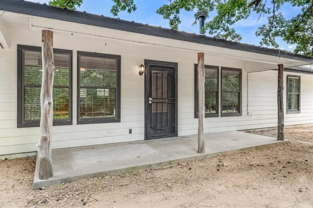 a view of a entryway door front of a house