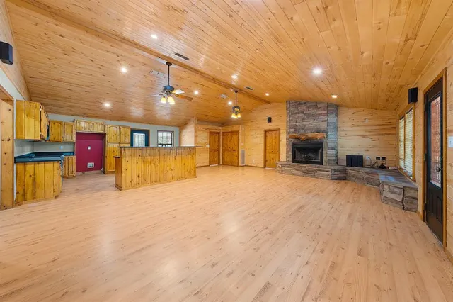 a view of a hall with wooden floor
