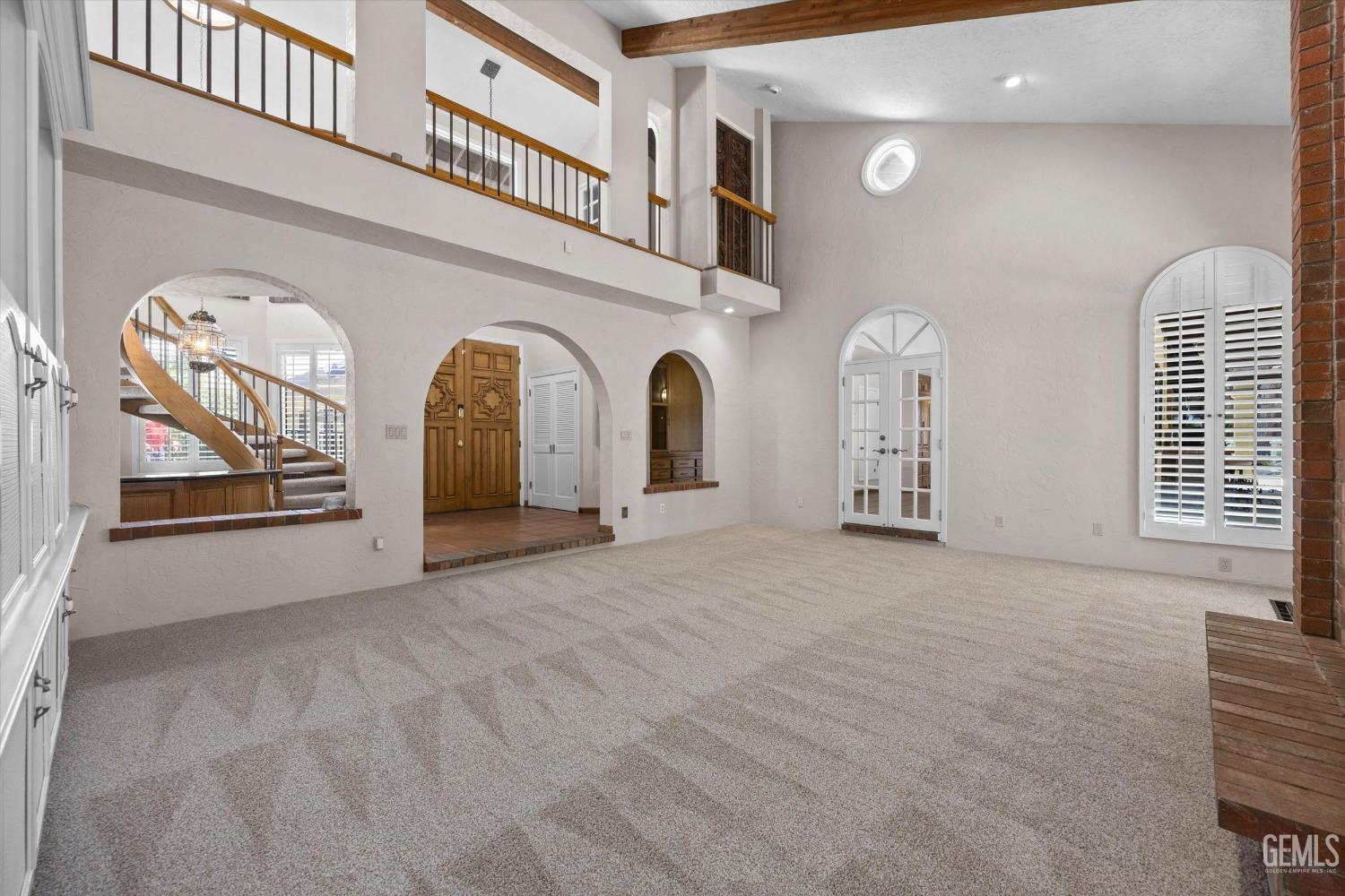 Undisclosed Address Bakersfield, CA 93306 - Photo 16 of 75 a view of a livingroom with a staircase