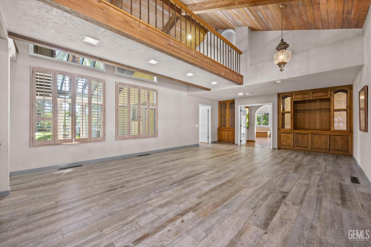 Undisclosed Address Bakersfield, CA 93306 - Photo 19 of 75 a view of an entryway with wooden floor