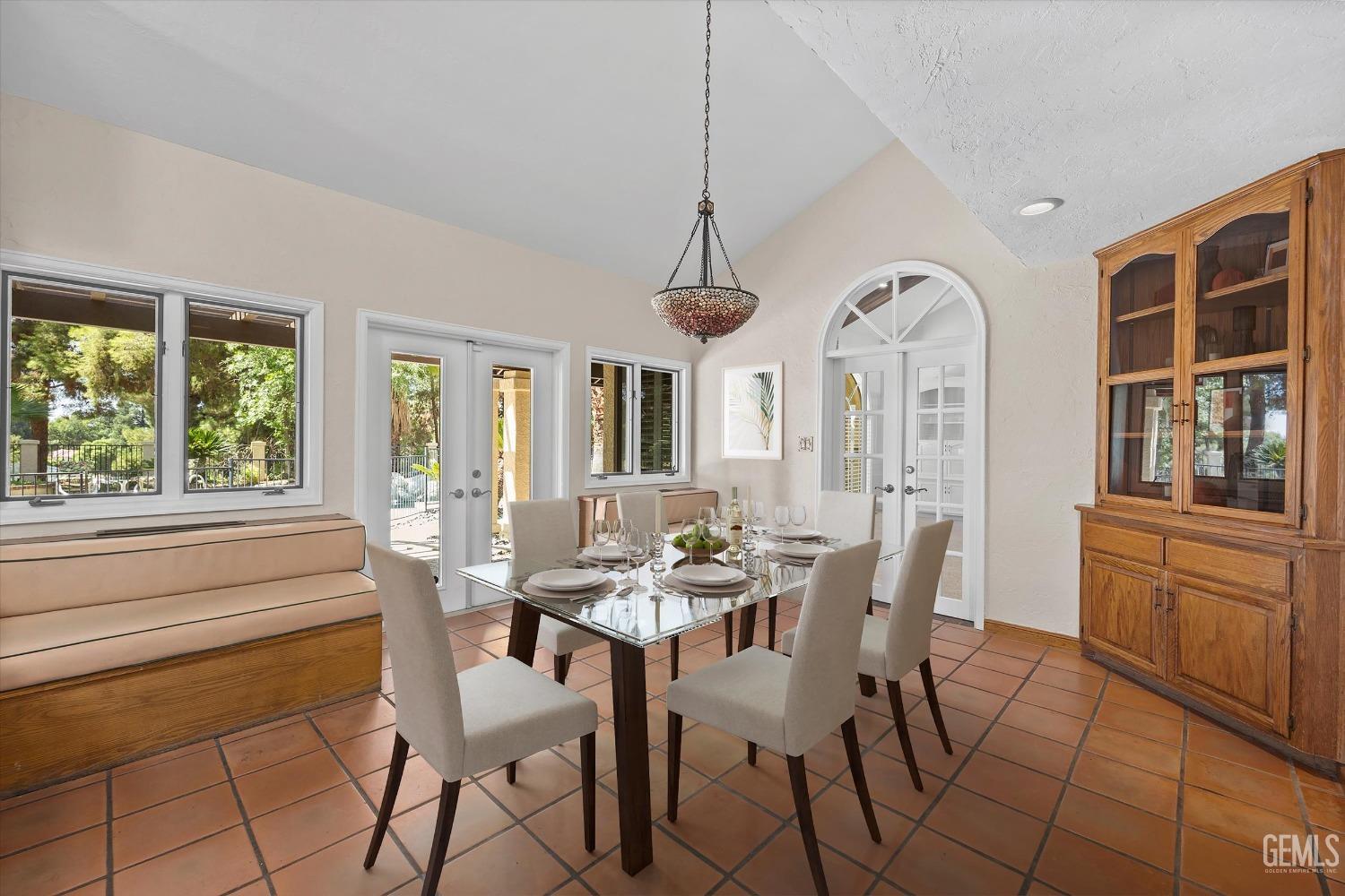 Undisclosed Address Bakersfield, CA 93306 - Photo 25 of 75 a view of a dining room with furniture large windows and wooden floor